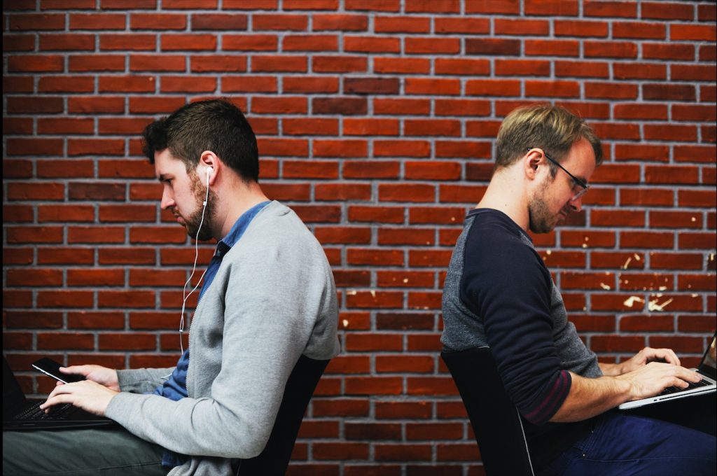 two guys working in the shared office